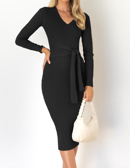 The Knit Sweater Dress in black — three-quarter view