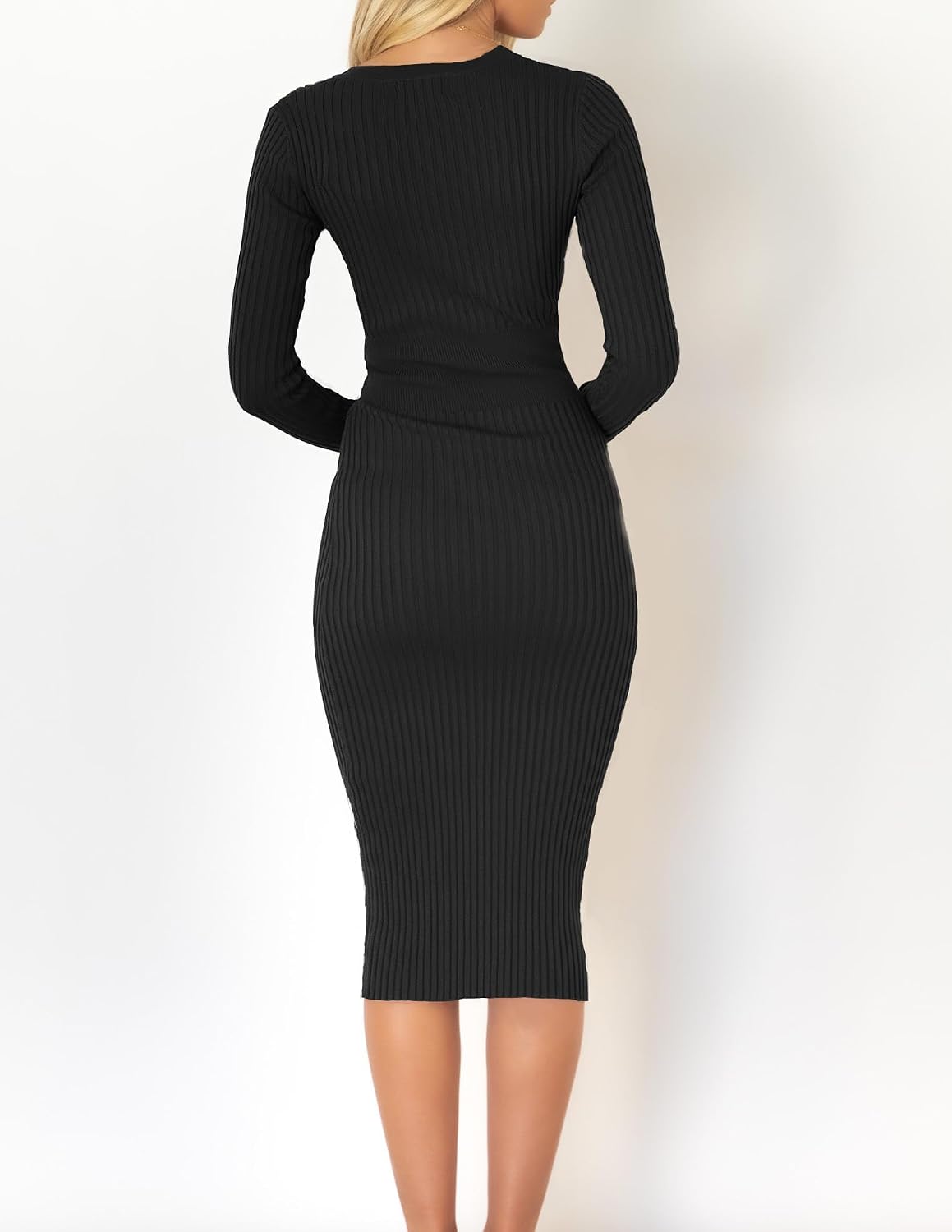 The Knit Sweater Dress in black — back view